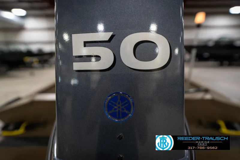 Slide: The Image of Close-up of 2007 G3 1860 CCT boat engine with '50' marking in a showroom. - 43