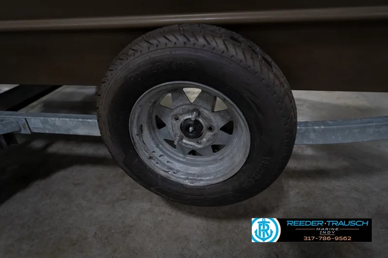 Slide: The Image of Trailer wheel of a 2007 G3 1860 CCT boat, displayed indoors. - 50