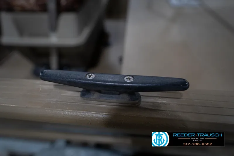 Slide: The Image of Close-up of a boat cleat on a 2007 G3 1860 CCT, Reeder Trausch Marine logo visible. - 52