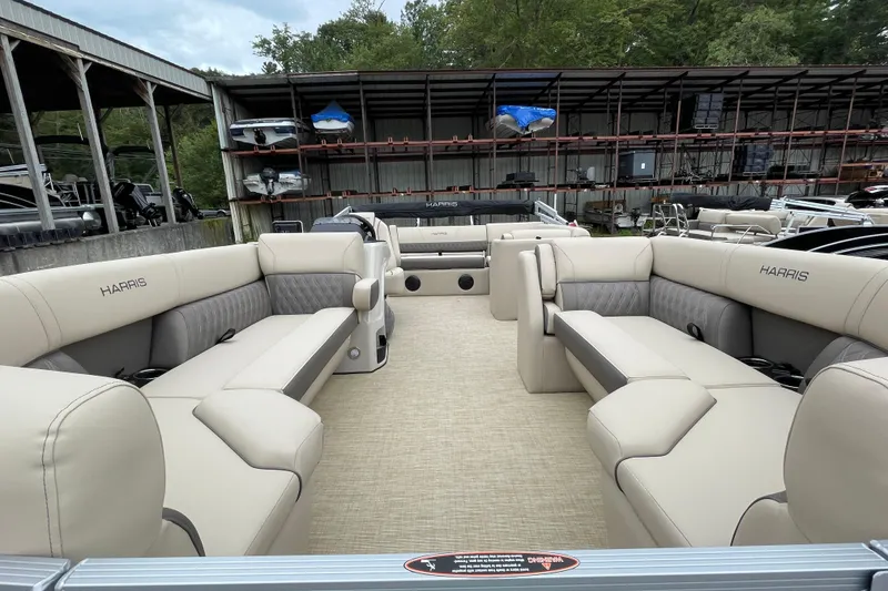 Slide: The Image of 2026 Harris Cruiser 230 pontoon boat with spacious seating and modern design. - 8