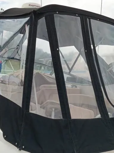 Slide: The Image of 2004 Chaparral Signature 350 boat with clear enclosure and black trim. - 25