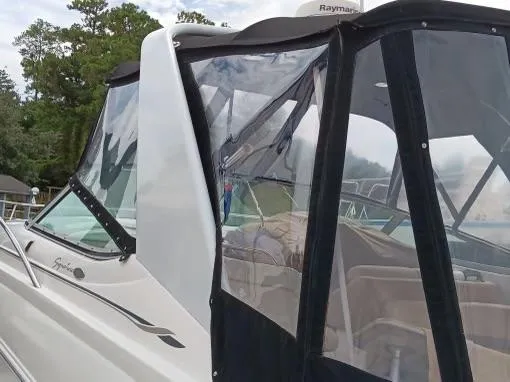 Slide: The Image of 2004 Chaparral Signature 350 boat with clear enclosure and sleek design. - 26