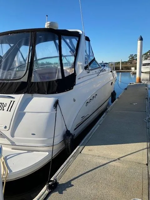 Slide: The Image of 2004 Chaparral Signature 350 boat docked at marina under clear blue sky. - 3
