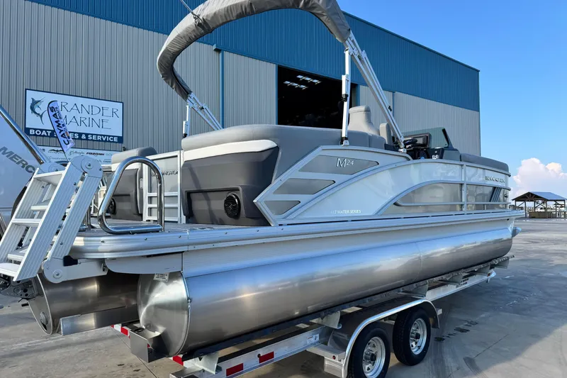 Slide: The Image of 2026 Bennington 24 MFB pontoon boat on trailer at marina. - 6