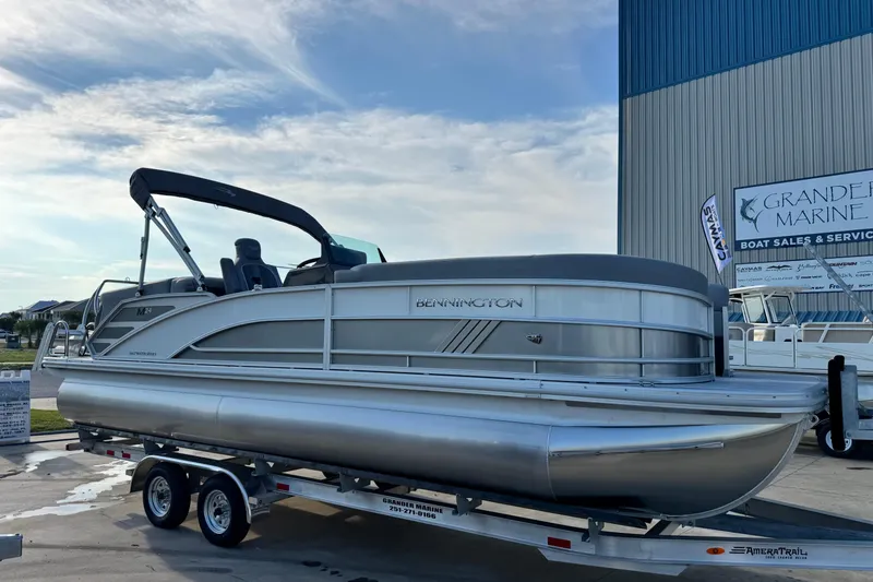 Slide: The Image of 2026 Bennington 24 MFB pontoon boat on trailer at Grande Marine dealership. - 7