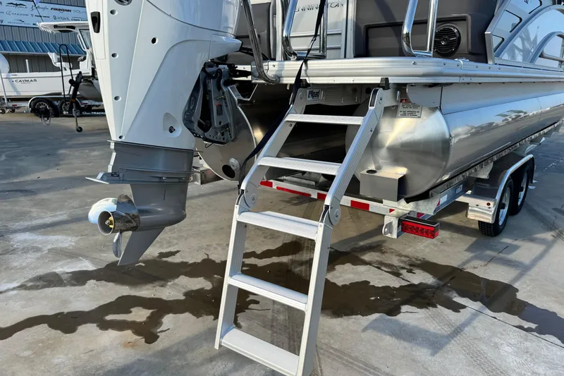 Slide: The Image of 2026 Bennington 24 MFB pontoon boat with outboard motor and boarding ladder. - 8