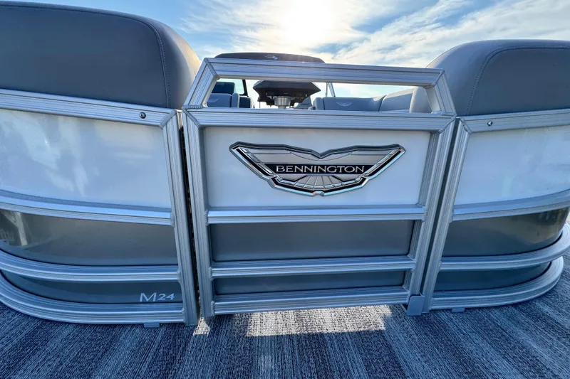 Slide: The Image of 2026 Bennington 24 MFB pontoon boat rear view with logo and seating. - 9