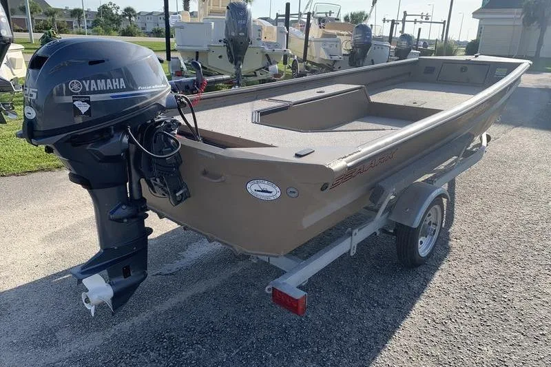 Slide: The Image of 2025 SeaArk DXS 1548 DKLD boat with Yamaha outboard motor on trailer. - 3