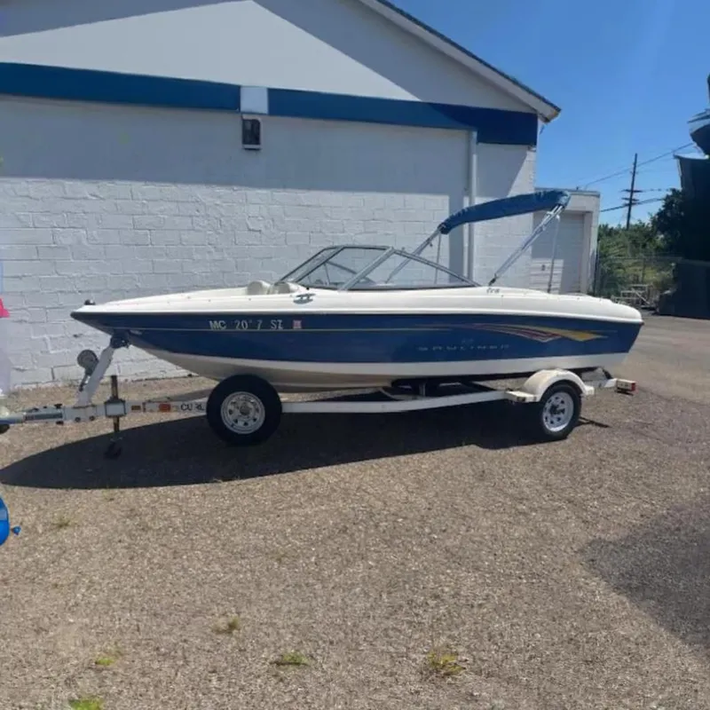 The Image of 2007 Bayliner 175 Bowrider boat on trailer, parked outdoors. - 0