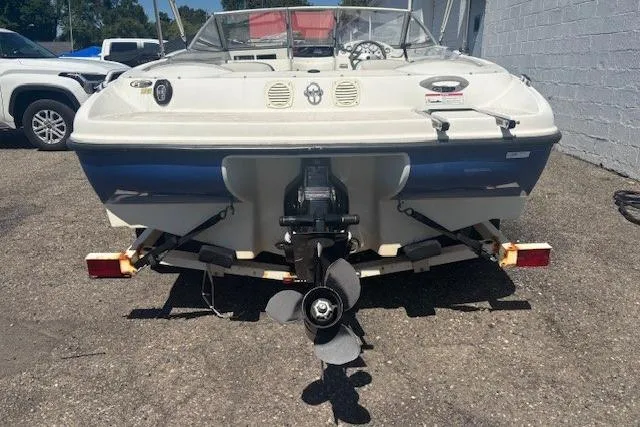 Slide: The Image of 2007 Bayliner 175 Bowrider interior with white seating and steering wheel. - 4