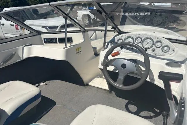Slide: The Image of 2007 Bayliner 175 Bowrider interior with white seats and steering wheel. - 5