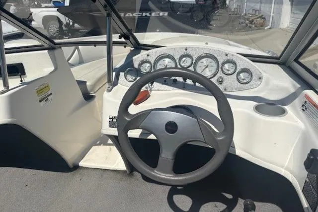Slide: The Image of 2007 Bayliner 175 Bowrider cockpit with steering wheel, gauges, and seating. - 6