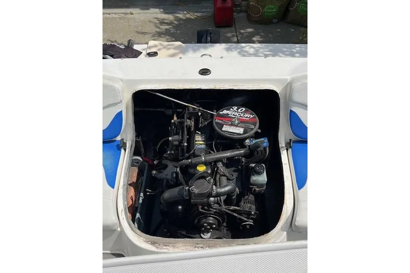 Slide: The Image of 2007 Bayliner 175 Bowrider engine compartment with 3.0L Mercury motor visible. - 9