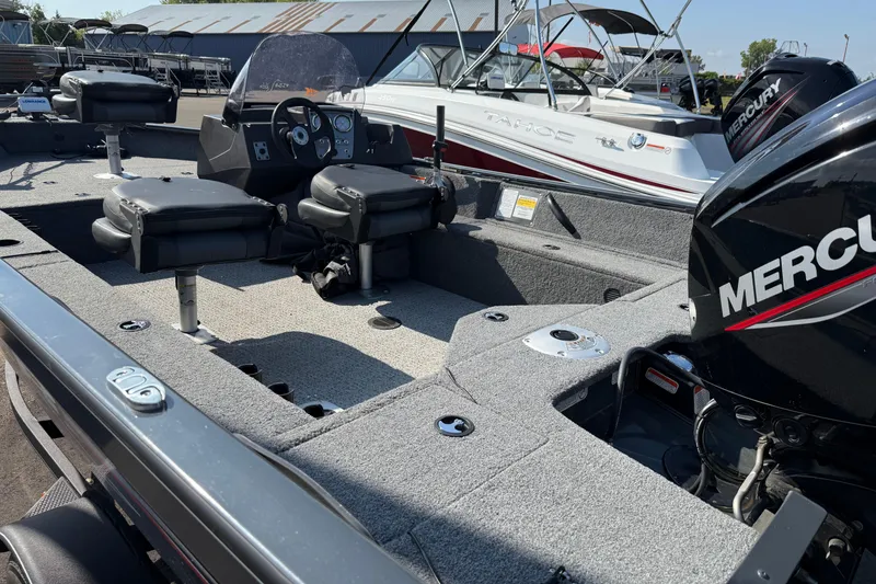 Slide: The Image of 2022 Tracker PGV16SC fishing boat with Mercury engine, featuring spacious seating and modern controls. - 5