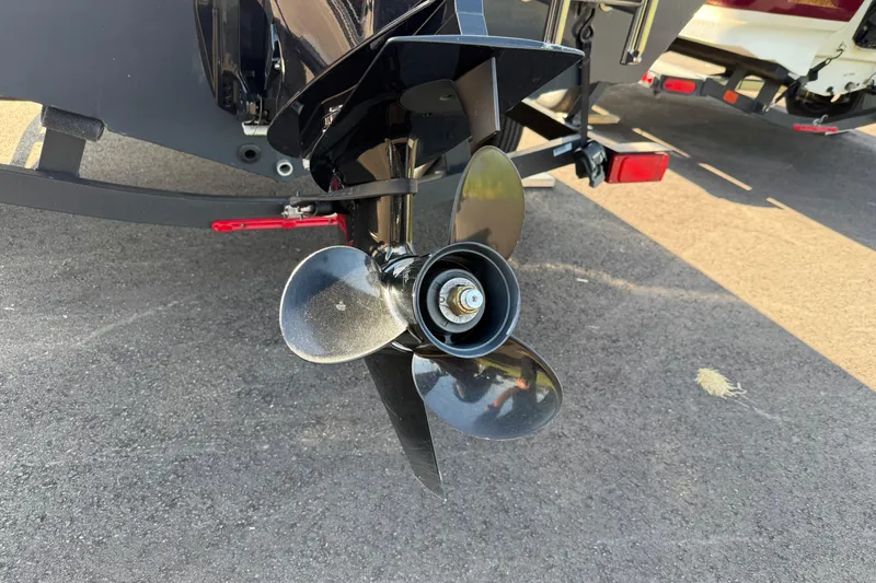 Slide: The Image of 2022 Tracker PGV16SC boat propeller on asphalt surface. - 7