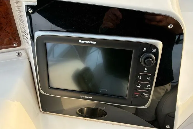 Slide: The Image of Raymarine HybridTouch display on 2005 Silverton 34 Convertible boat dashboard. - 10