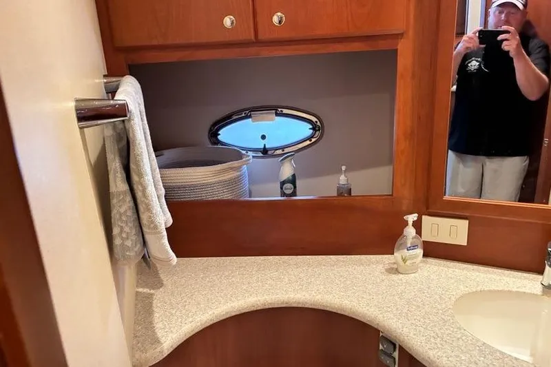 Slide: The Image of Bathroom interior of 2005 Silverton 34 Convertible yacht with mirror and sink. - 19