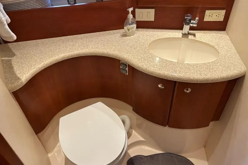 Slide: The Image of Bathroom interior of 2005 Silverton 34 Convertible yacht with sink and toilet. - 23