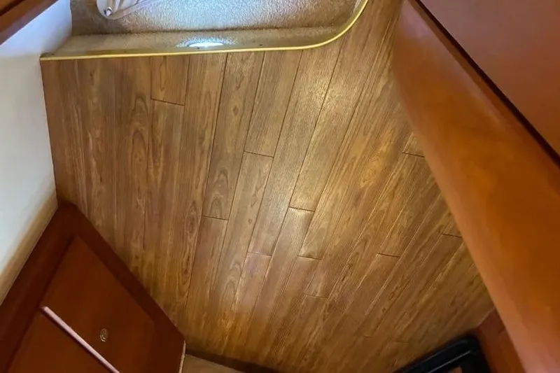 Slide: The Image of Interior view of 2005 Silverton 34 Convertible with wooden flooring. - 27