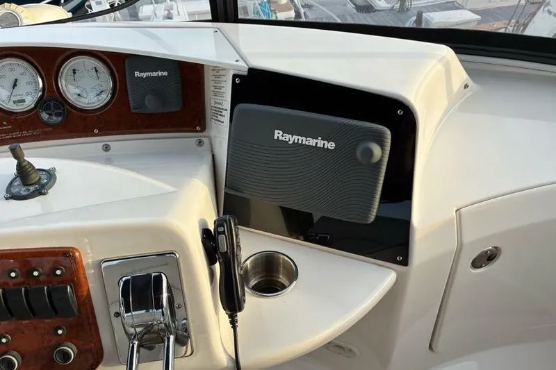 Slide: The Image of 2005 Silverton 34 Convertible helm with Raymarine electronics and control panel. - 4