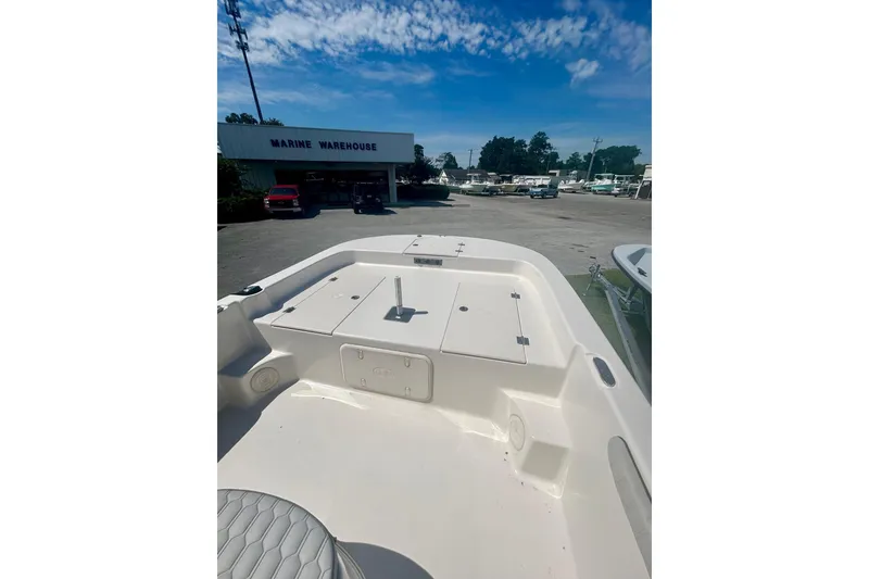 Slide: The Image of 2025 Carolina Skiff 21 LS boat at Marine Warehouse under a clear blue sky. - 11