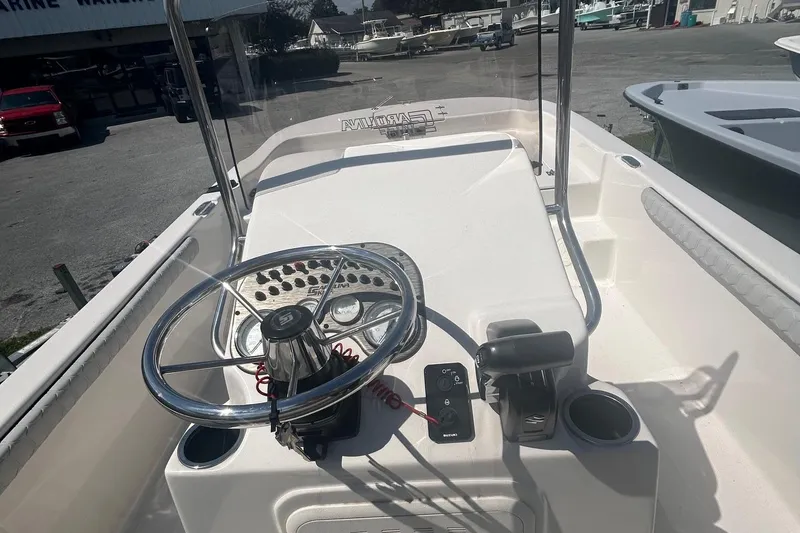 Slide: The Image of 2025 Carolina Skiff 21 LS boat console with steering wheel and controls. - 12