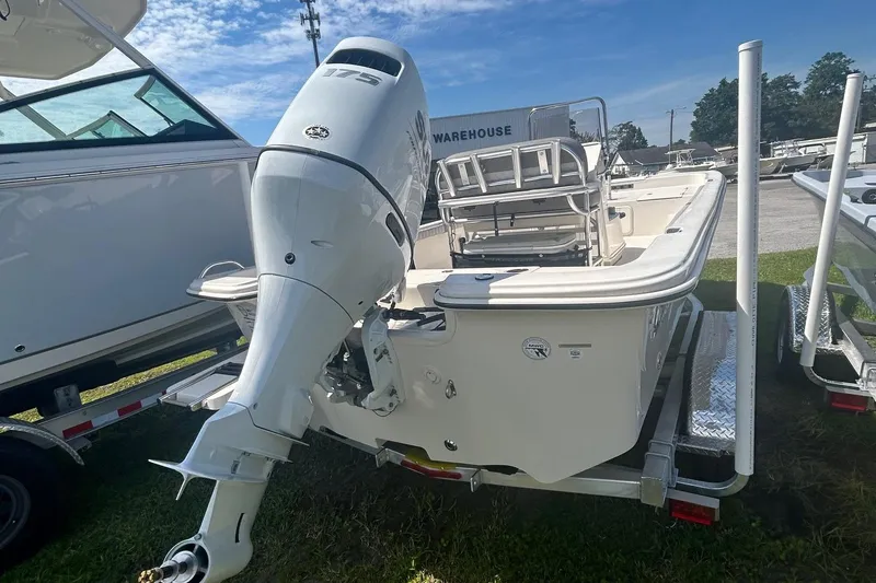 Slide: The Image of 2025 Carolina Skiff 21 LS boat with powerful outboard motor on trailer. - 2