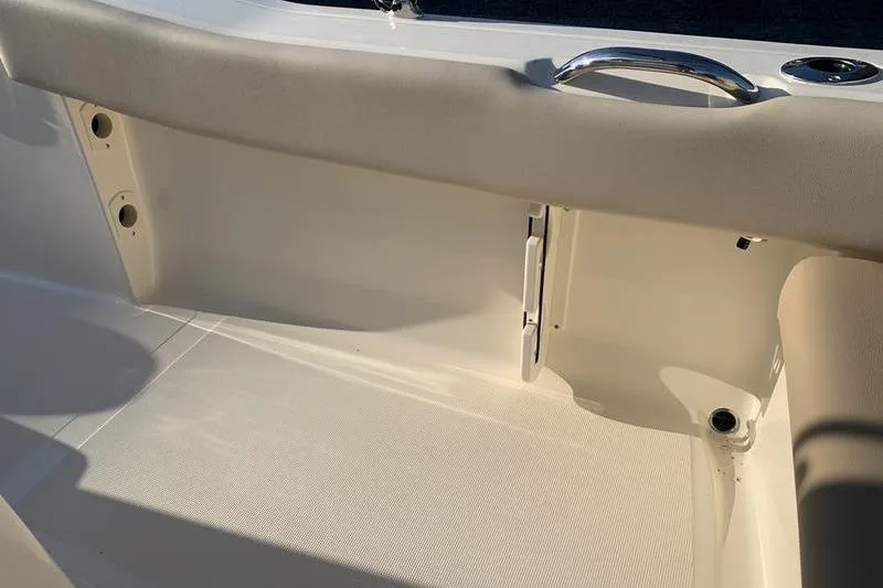 Slide: The Image of 2026 Scout 195 Sportfish interior detail with beige seating and stainless steel handle. - 12