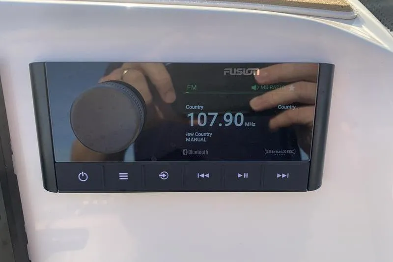 Slide: The Image of Fusion radio display on 2026 Scout 195 Sportfish, tuned to 107.90 MHz FM. - 15