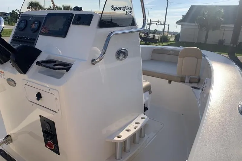 Slide: The Image of 2026 Scout 195 Sportfish boat interior with console and seating. - 18