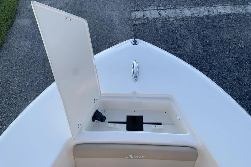 Slide: The Image of 2026 Scout 195 Sportfish boat with open storage compartment on deck. - 24