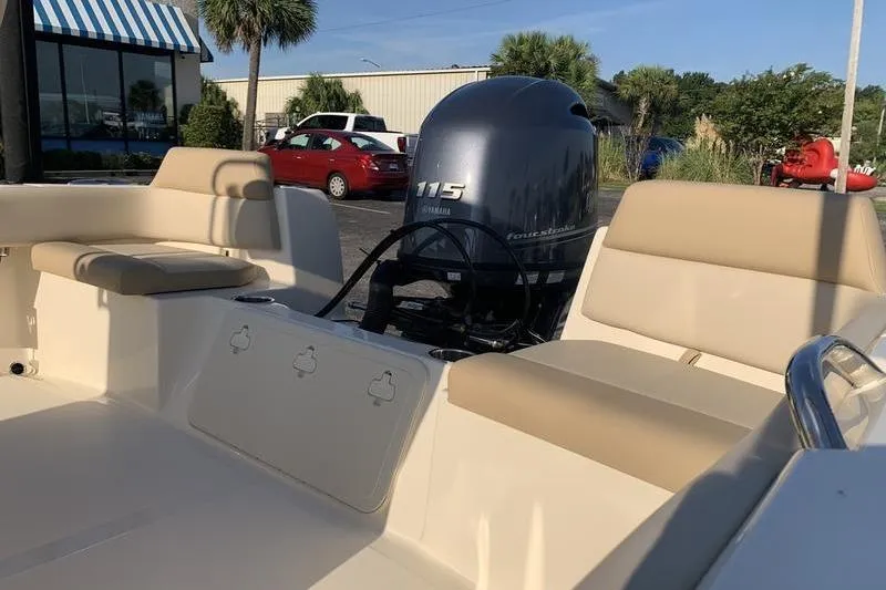 Slide: The Image of 2026 Scout 195 Sportfish boat interior with Yamaha 115 outboard motor. - 8