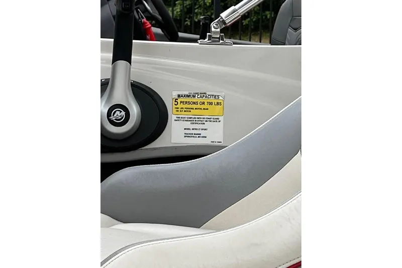 Slide: The Image of 2016 Tracker Nitro Z7 Sport boat interior with carpeted deck and control panel. - 4