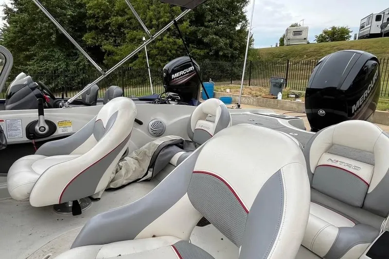 Slide: The Image of 2016 Tracker Nitro Z7 Sport boat interior with steering wheel and dashboard controls. - 8