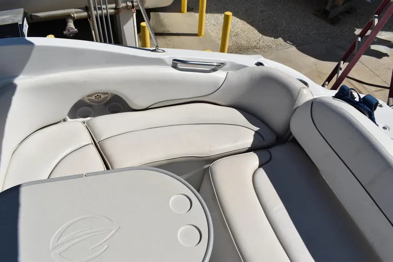 Slide: The Image of 2005 Crownline 275 CCR boat interior with white leather seating and table. - 13