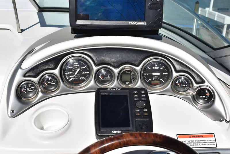 Slide: The Image of Dashboard of 2005 Crownline 275 CCR boat with gauges and navigation equipment. - 16