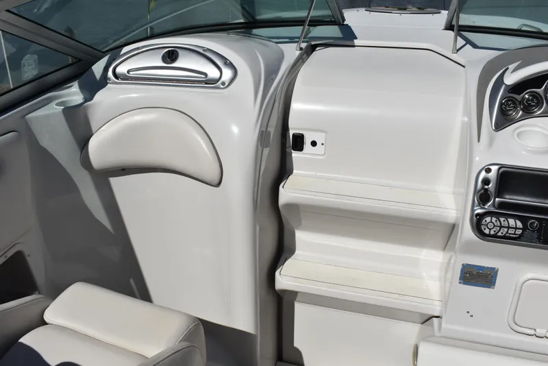 Slide: The Image of Interior view of 2005 Crownline 275 CCR boat cockpit with white seating and controls. - 27