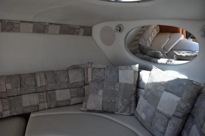 Slide: The Image of Interior of 2005 Crownline 275 CCR boat with patterned cushions and seating. - 31