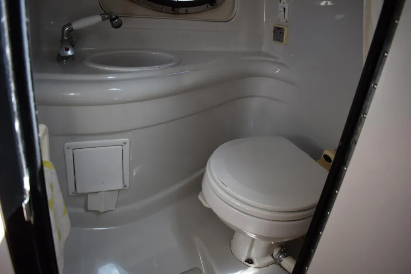 Slide: The Image of 2005 Crownline 275 CCR boat bathroom with sink and toilet. - 36