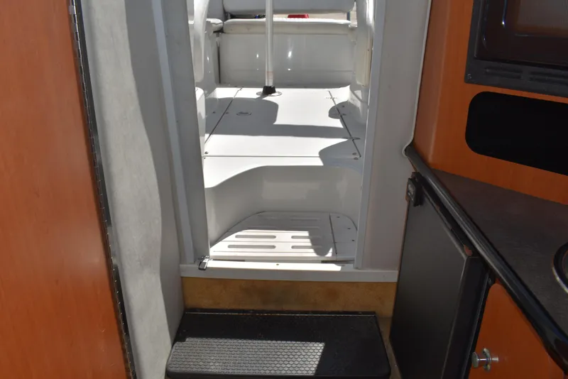 Slide: The Image of Interior view of 2005 Crownline 275 CCR boat cabin with steps and kitchenette. - 37