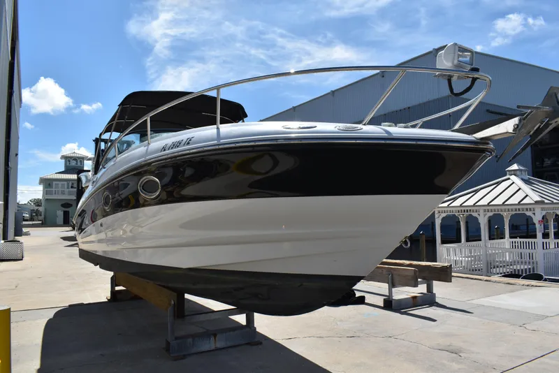 Slide: The Image of 2005 Crownline 275 CCR boat on dry dock under clear blue sky. - 4