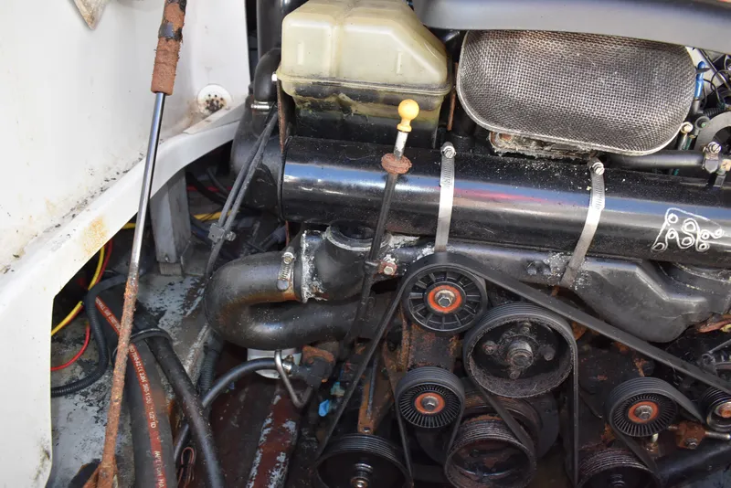 Slide: The Image of Engine compartment of 2005 Crownline 275 CCR boat, showing belts and components. - 44