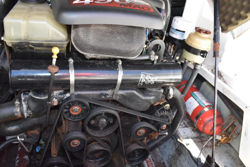 Slide: The Image of Engine of a 2005 Crownline 275 CCR boat with visible components and fire extinguisher. - 45