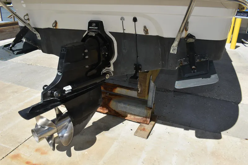 Slide: The Image of 2005 Crownline 275 CCR boat stern with propeller and trim tabs. - 46