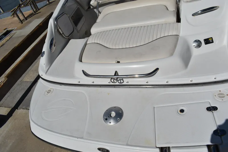 Slide: The Image of 2005 Crownline 275 CCR boat with white seating and deck details. - 8