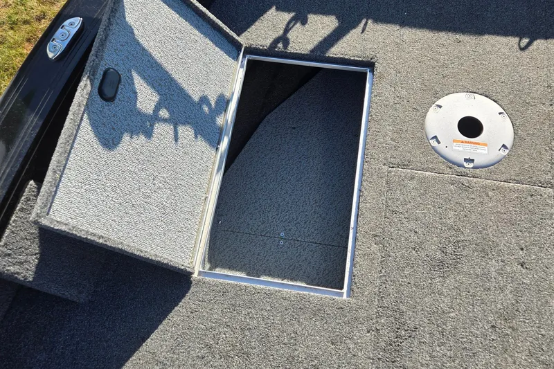 Slide: The Image of Open storage compartment on 2021 Crestliner 1850 Fish Hawk SC JS boat deck. - 13