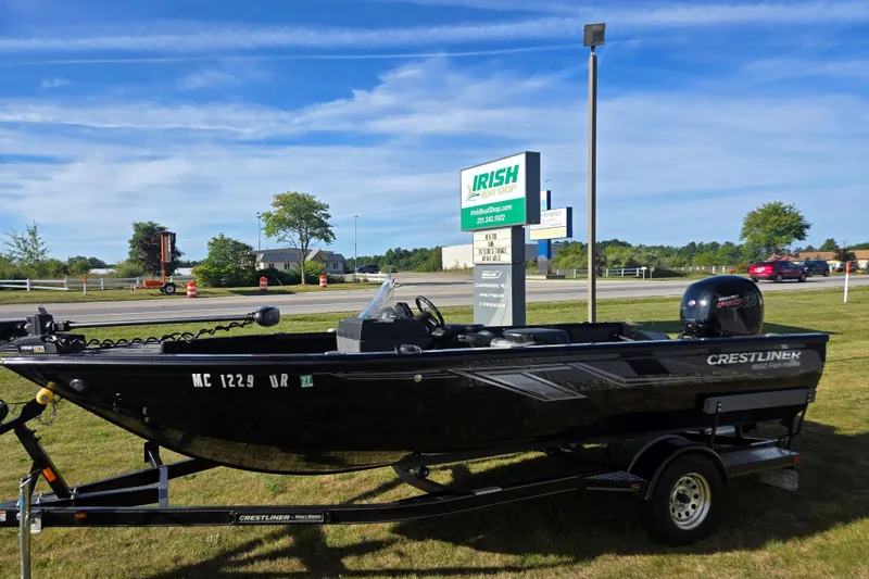 Slide: The Image of 2021 Crestliner 1850 Fish Hawk SC JS boat on trailer at Irish Boat Shop. - 2
