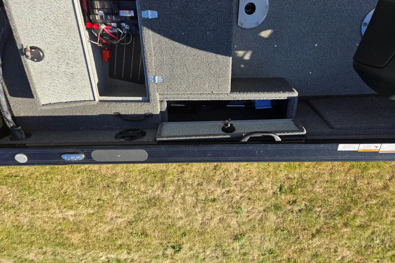 Slide: The Image of 2021 Crestliner 1850 Fish Hawk SC JS boat interior with open storage compartments. - 25