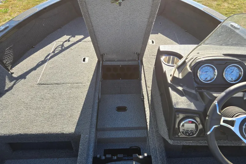 Slide: The Image of 2021 Crestliner 1850 Fish Hawk SC JS boat interior with open storage and dashboard. - 28