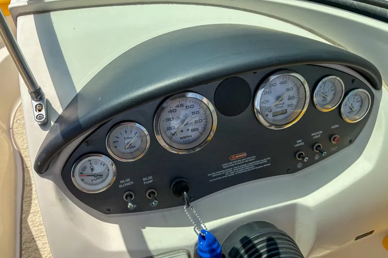 Slide: The Image of Dashboard of a 2007 Sea Ray 195 Sport boat with gauges and controls. - 10